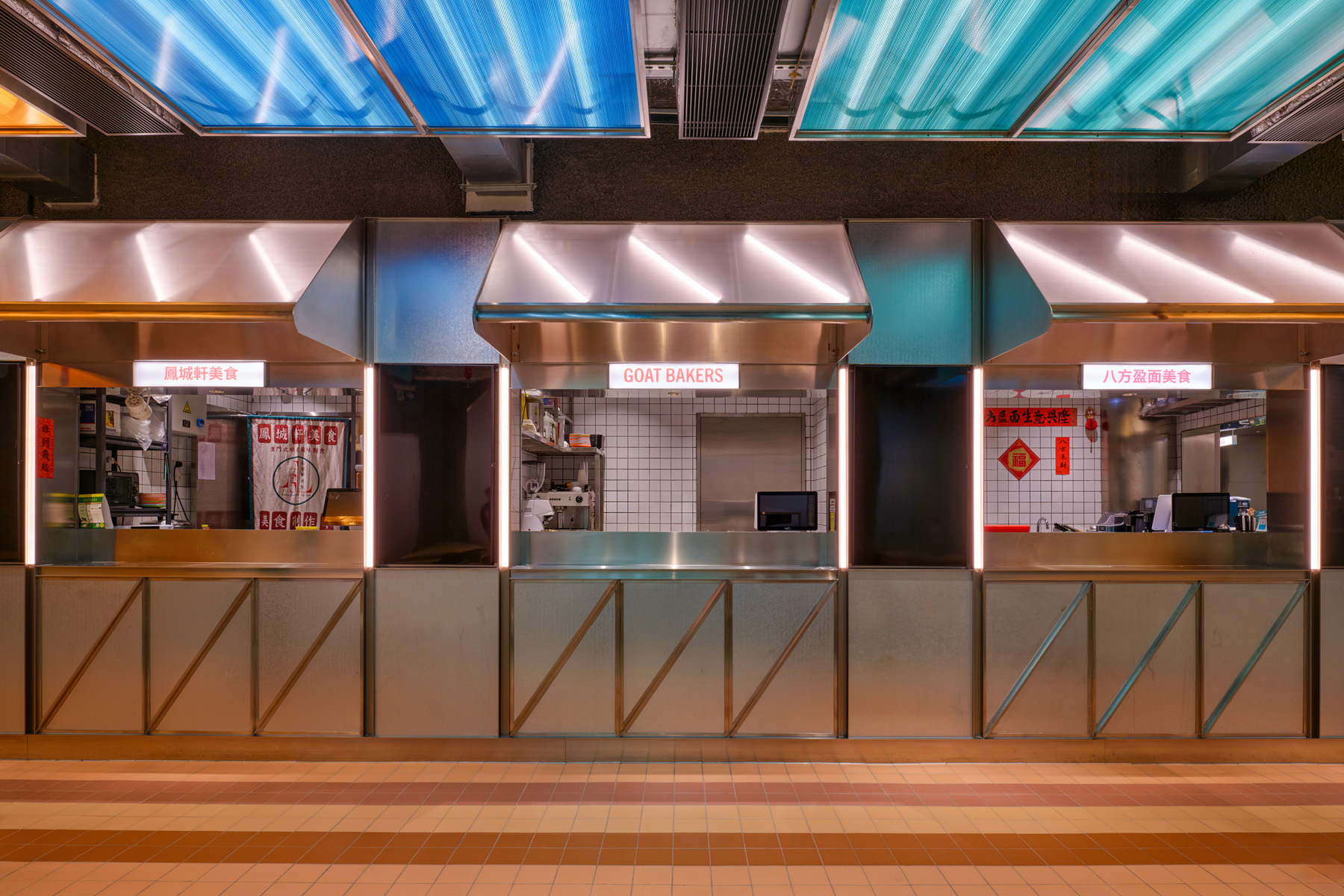 NIO Beijing interior lighting store with glowing curved façade and soft lighting design for retail store welcoming visitors at night.