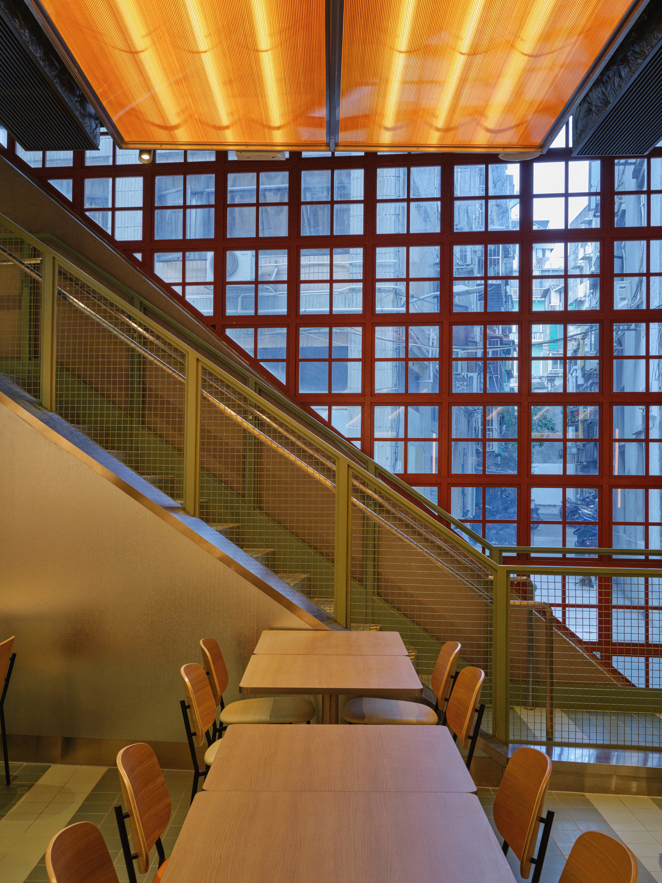 Side view of SUV in NIO Beijing interior lighting store against neutral walls with gallery-style lighting design for retail store car presentations.